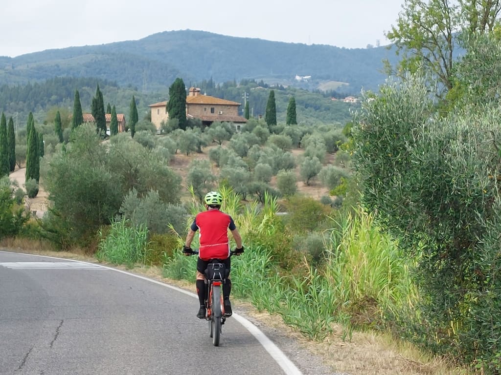 Cyclist riding through the Apennines on the Venice to Florence bike tour