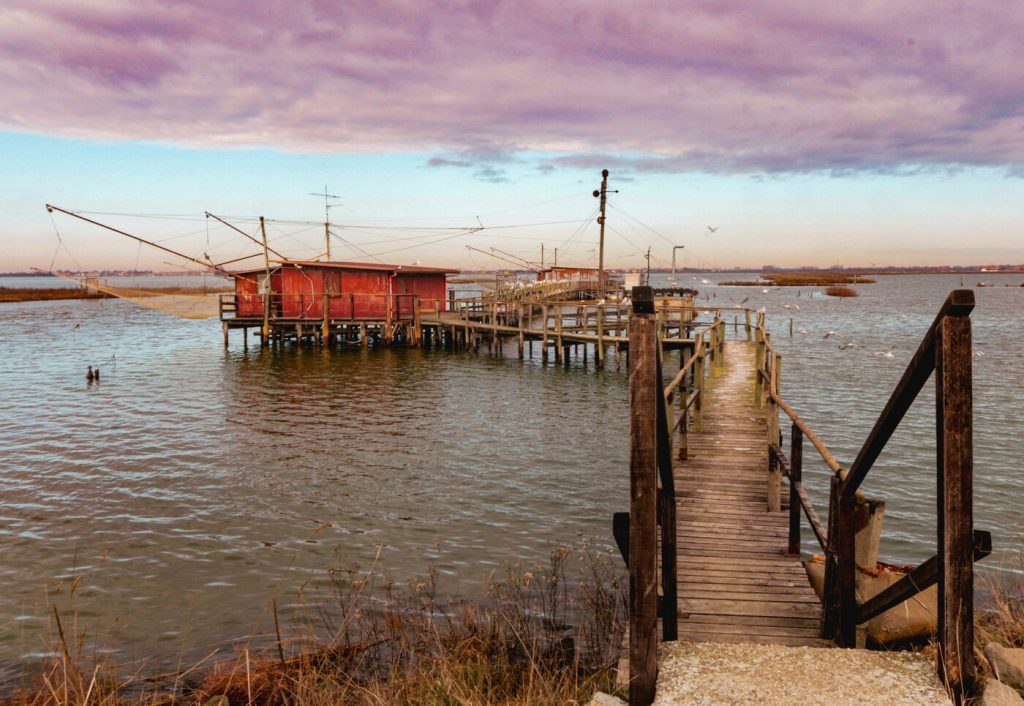 Traditional fishing hut in the Po River Delta on a cycling tour in Italy