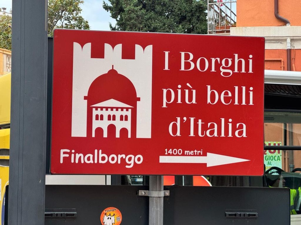 Finalborgo sign during a cycling trip in Finale Ligure