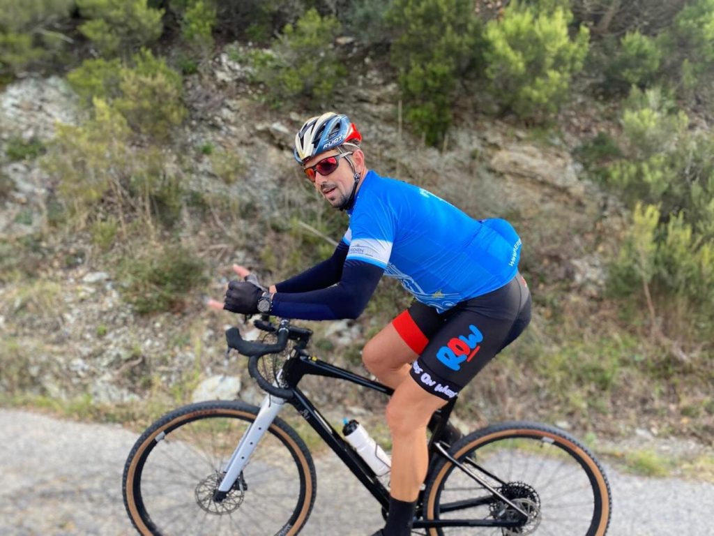 Cyclist riding a gravel bike near Finale Ligure