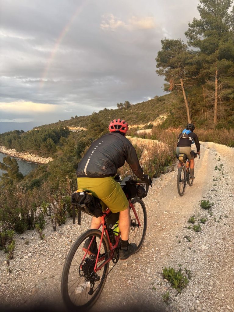 Gravel cyclists riding a rocky trail on the Dalmatian Islands during a Croatia gravel bike tour.